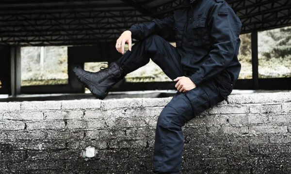 fashion guy sitting on border